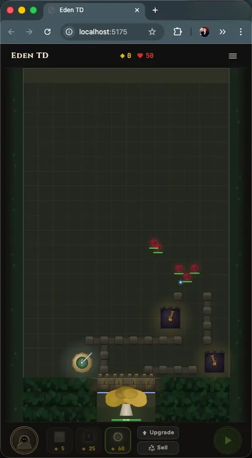 The early mobile redesign Claude built, in a phone-width browser window: a tall board with a short maze of walls, towers and enemies above the Edentree, and a tray of three towers with Upgrade and Sell along the bottom.