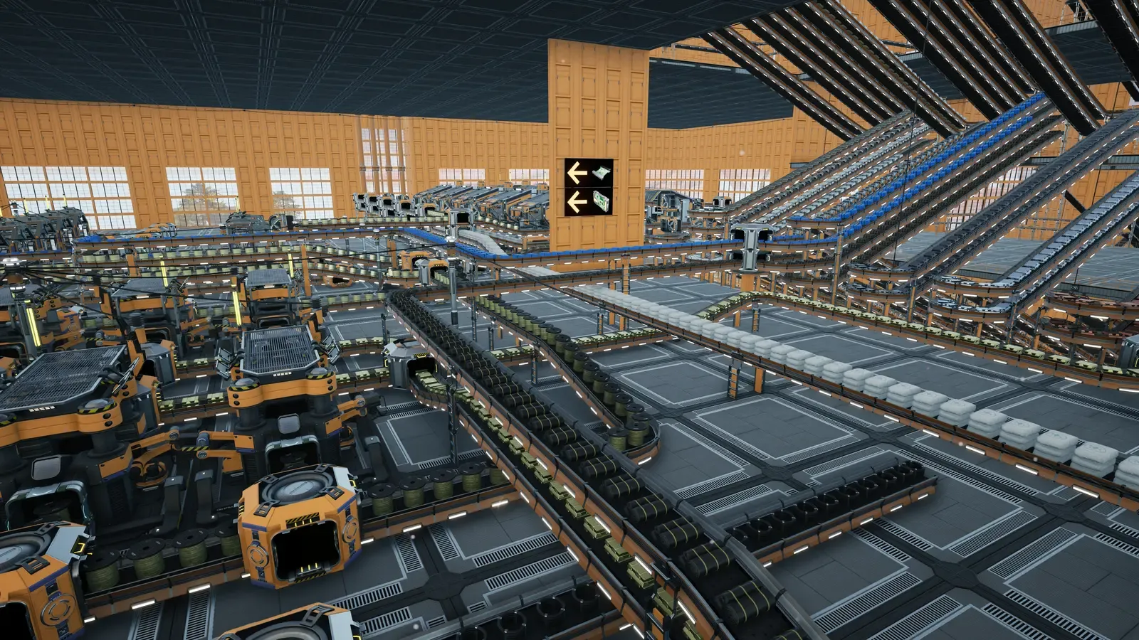 A large Satisfactory factory inside an orange-walled hall: dozens of conveyor belts on stacked levels carry parts between rows of machines, with ramps of belts climbing toward the ceiling.